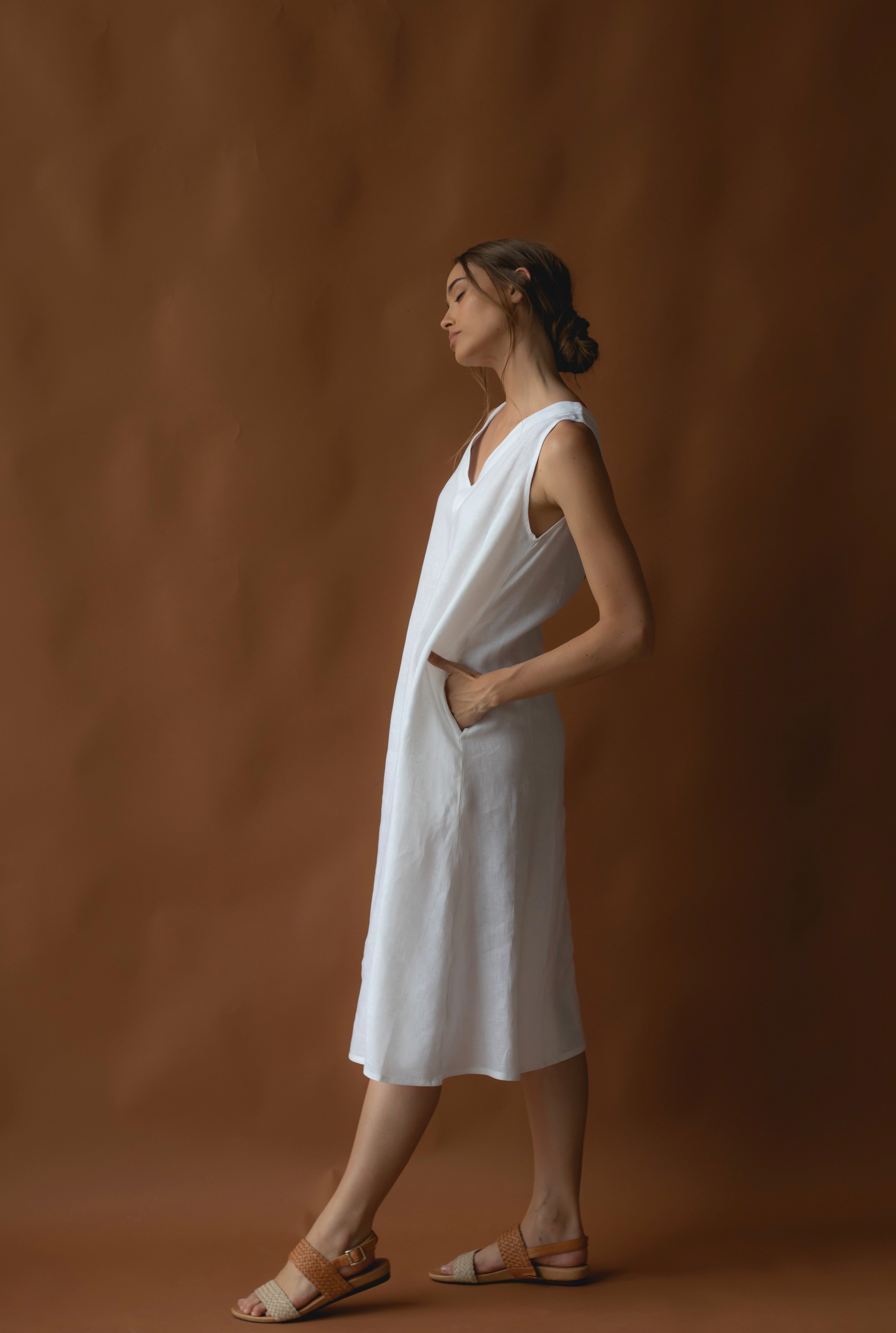 women wearing a long white linen dress on sale