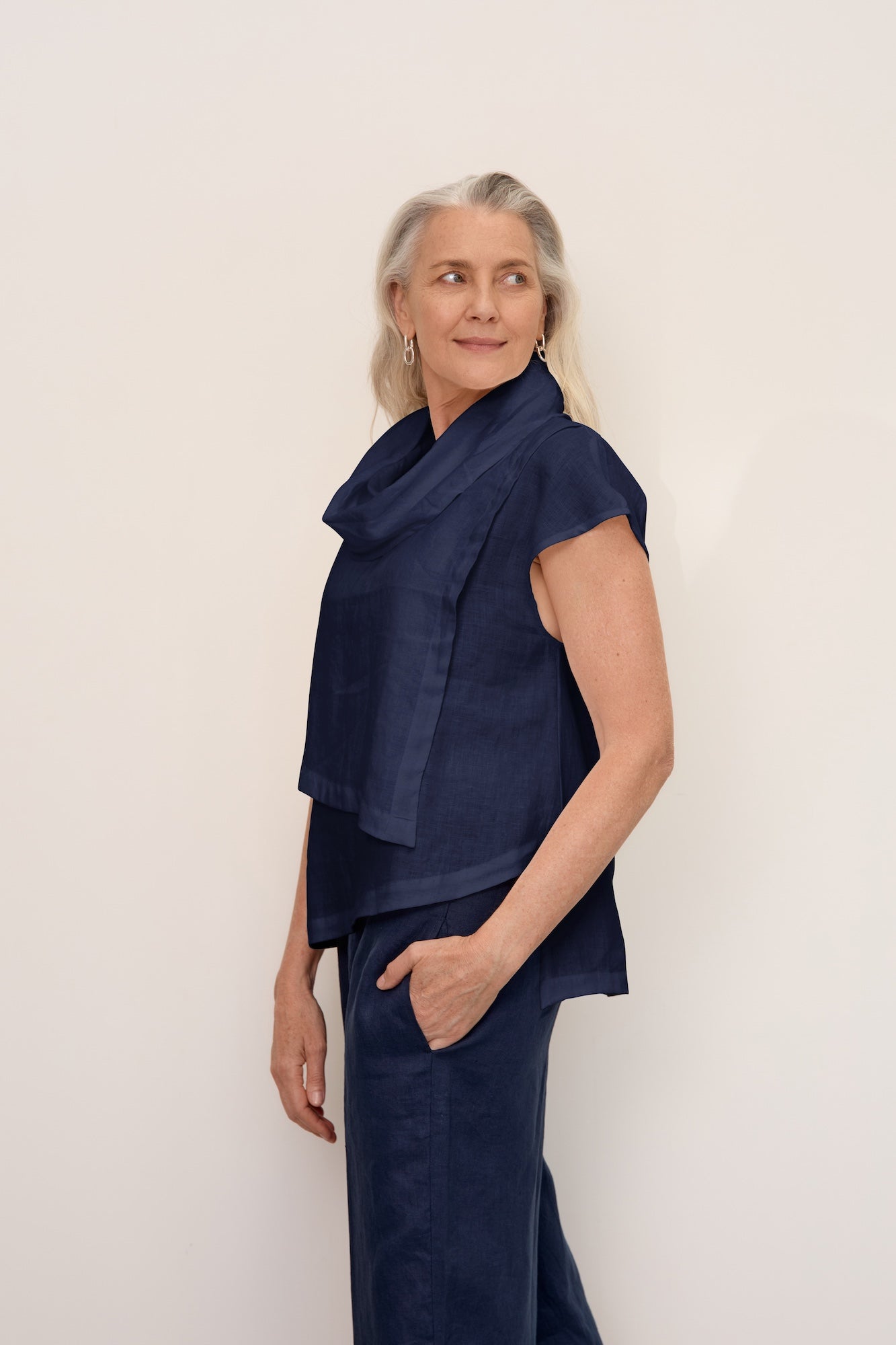 Women wearing new charcoal linen dress with sleeves and knitted cotton vest