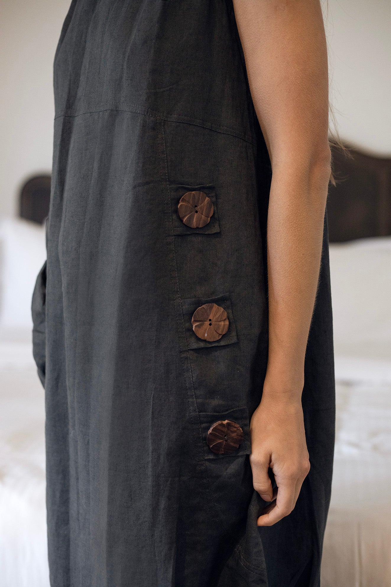 Daisy Linen Dress Charcoal showcasing statement buttons, perfect for a stylish and comfortable look.