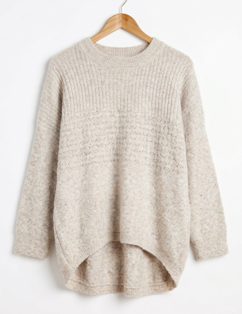 Marlo Wool Blend Jumper Soft Stone displayed on a hanger, showcasing its soft knit texture and relaxed style.